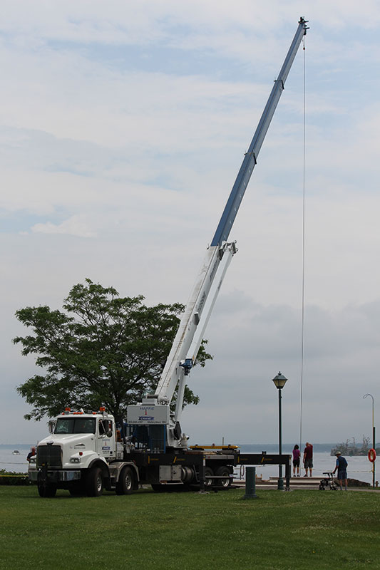 Haffie Crane Ltd - Mallorytown Ontario - Crane lifting statues into the St. Lawrence River for divers.